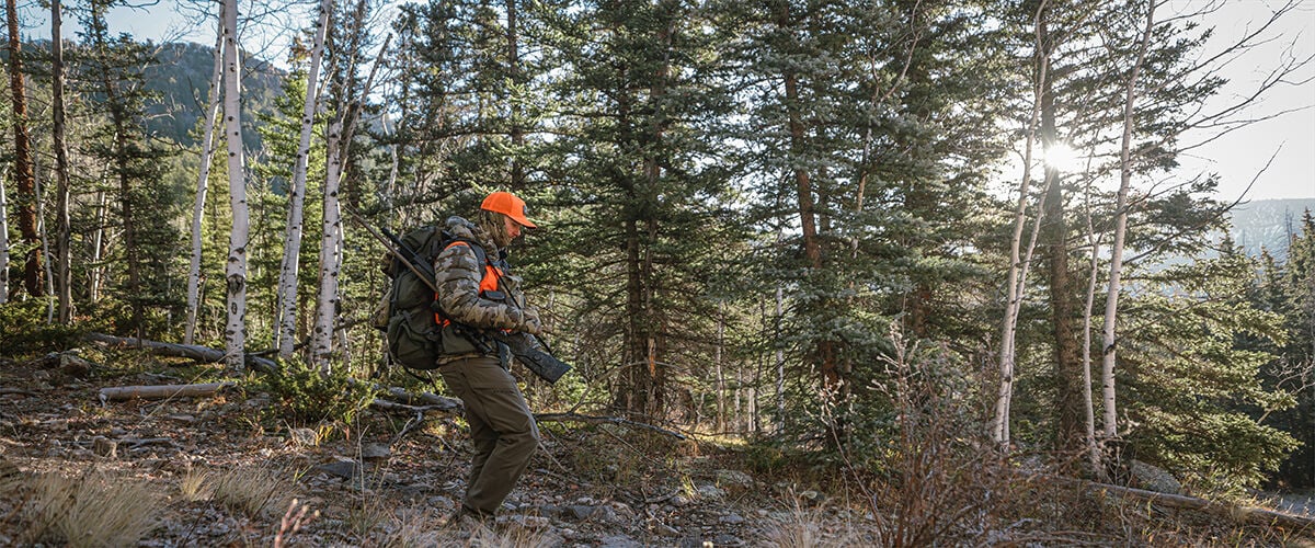 man walking in the woods